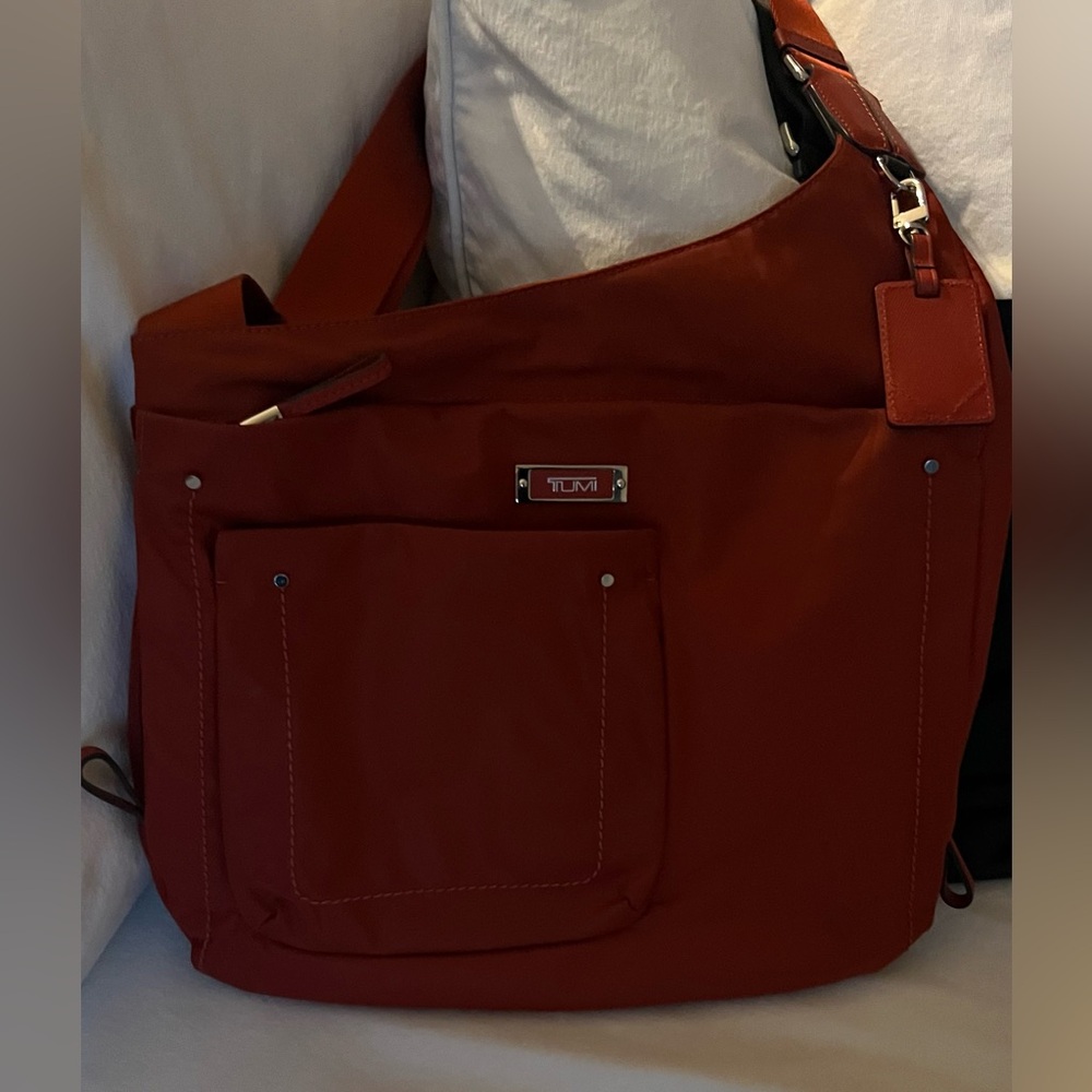 Tumi Black and Burnt Orange cross body Backpack